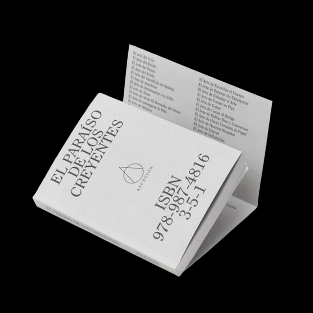 Book titled 'El Parañso de los Creyentes' with ISBN and publisher details on a gray background